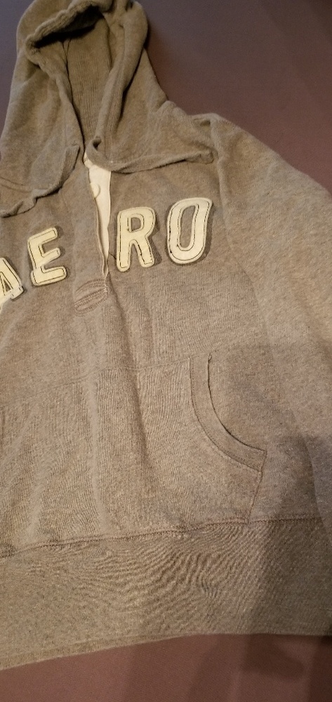 Cropped, hooded sweatshirt with front pocket.